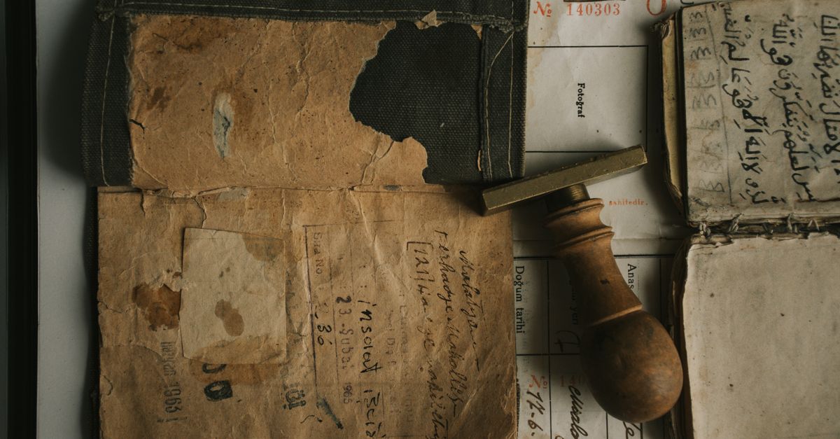 Ancient Filing System Ancient Documents and Stamp on Table · Free Stock Photo