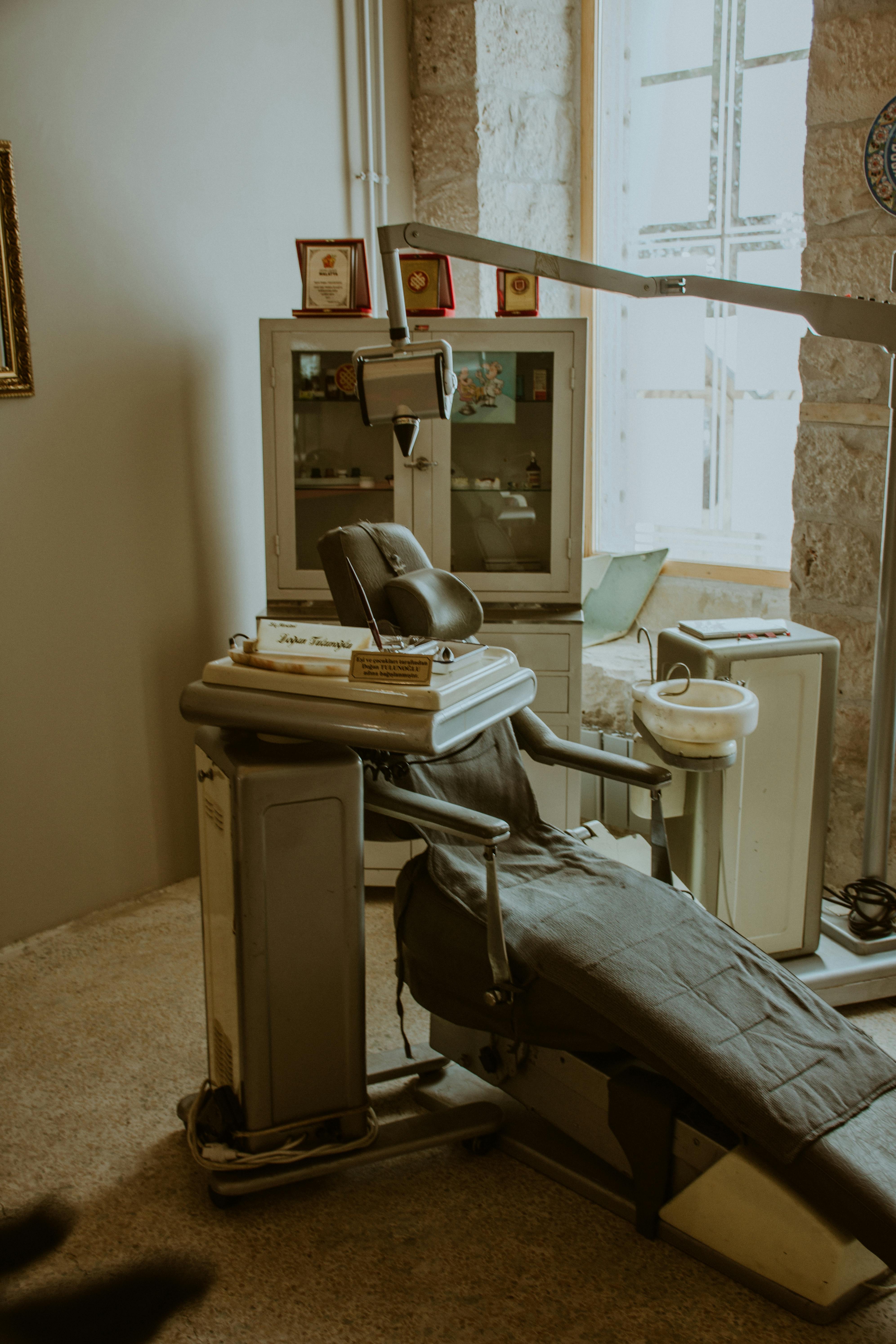 Dentist reviewing dental health history form with a patient