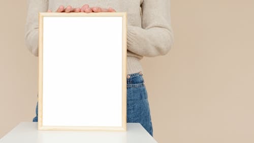 Person holding Wooden Frame