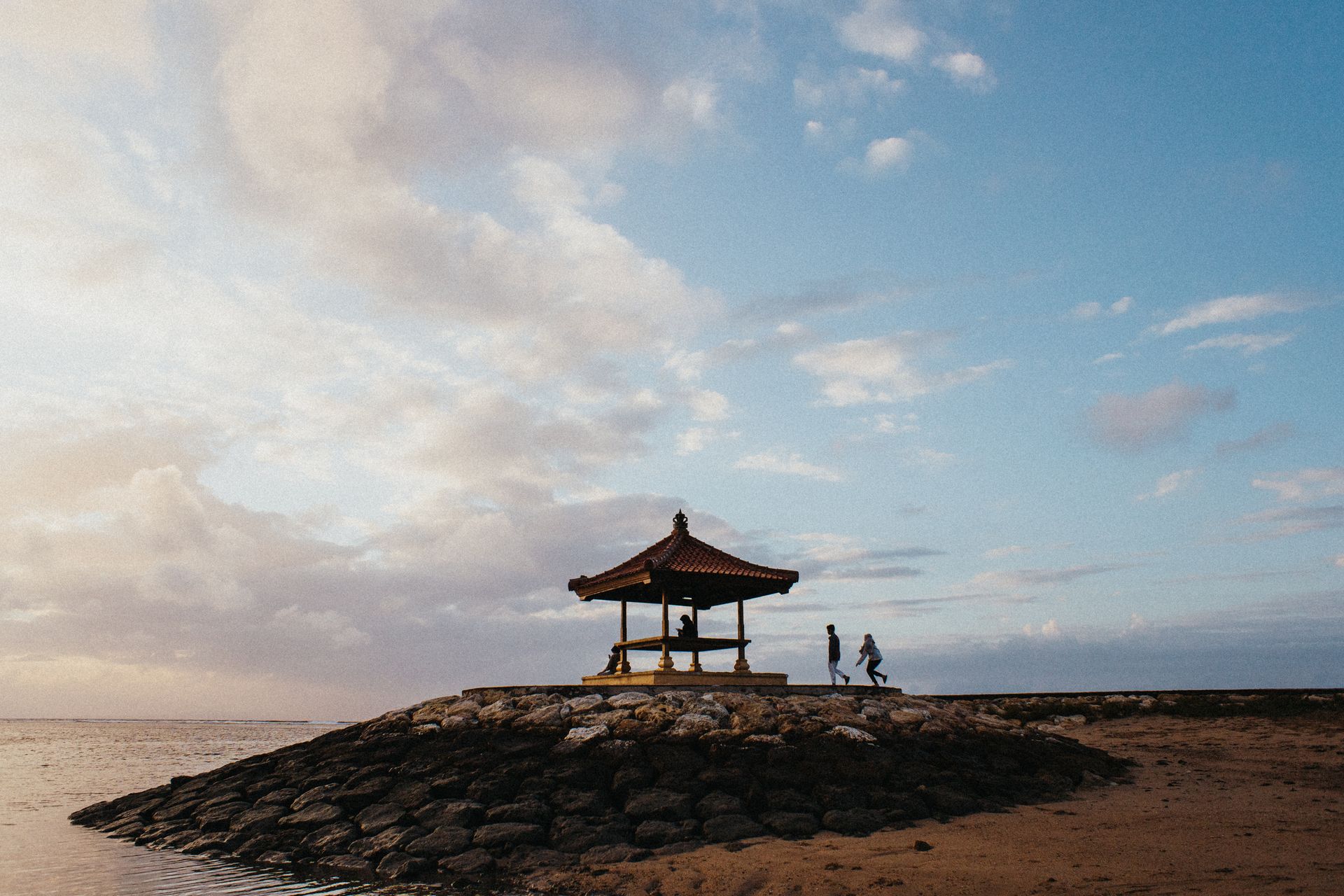 Charming gazebo overlooking the calm sea in Bali, perfect for a peaceful vacation.