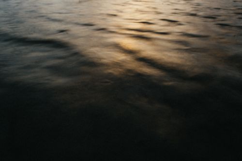 Free Gentle waves and warm sunlight on the ocean surface in Bali, Indonesia. Stock Photo