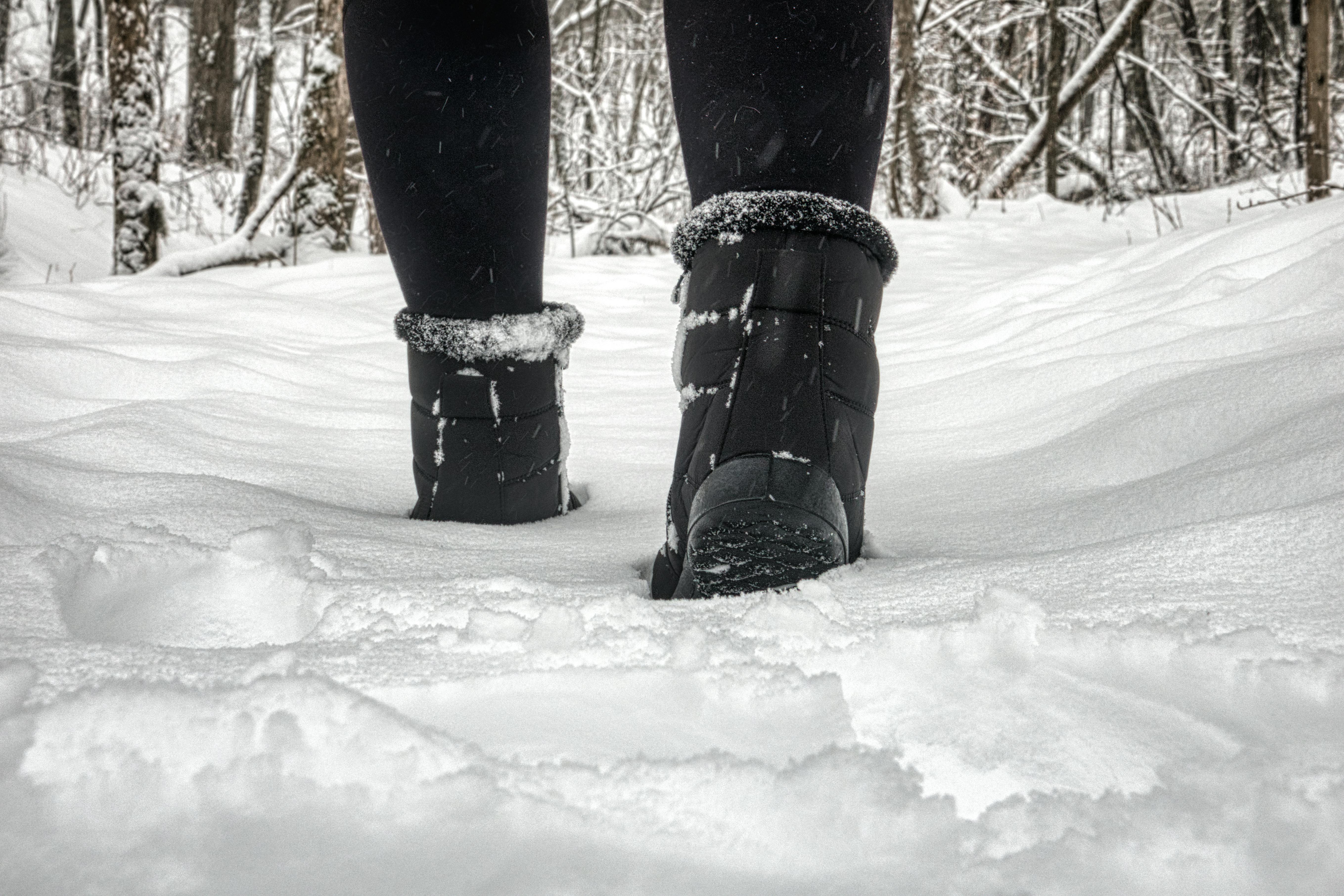 Closeup of Person in Winter Boots Walking in Snow · Free Stock Photo