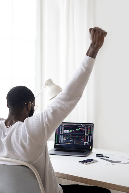 Free Successful Person Raising his Hand Stock Photo