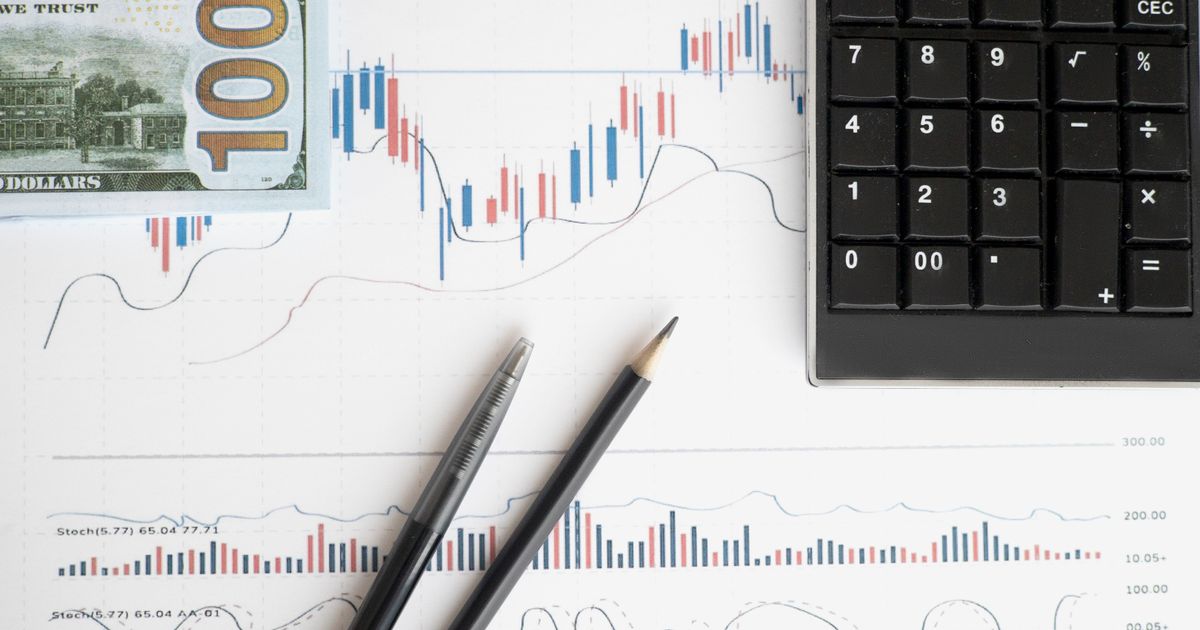 Stock analysis workspace featuring charts, a calculator, and currency for data-driven insights.