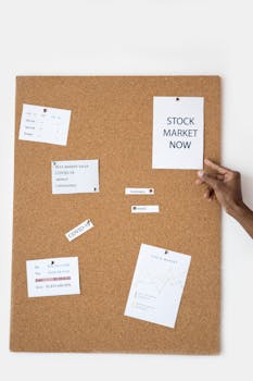 Stock market concepts pinned on a cork board for visual reference.