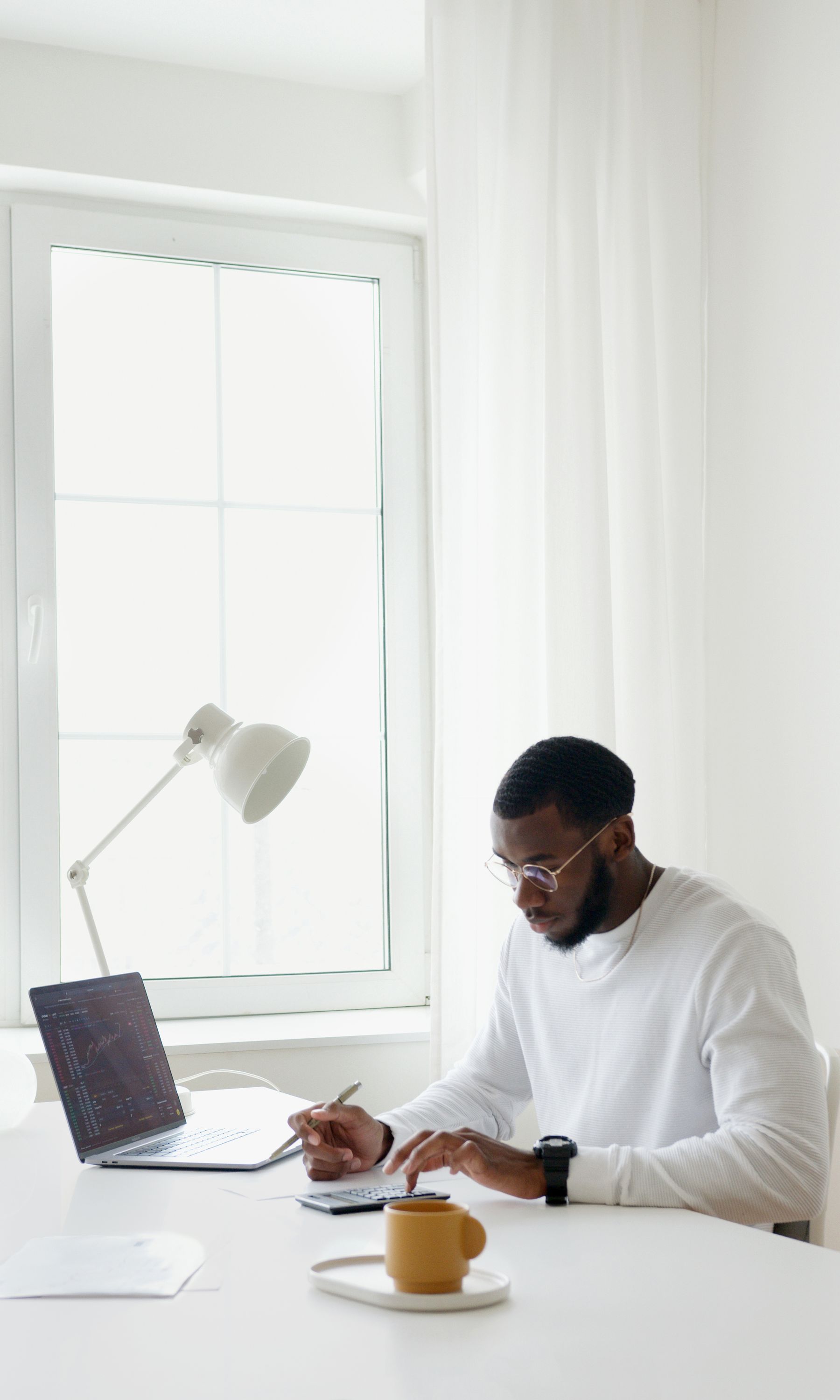 Professional working at a bright, uncluttered desk