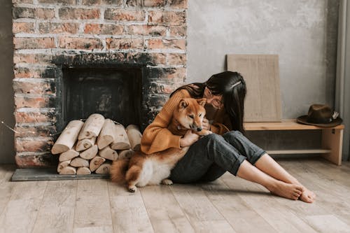 A Woman Hugging Her Dog