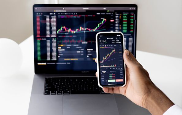 Analyst taking notes during market review