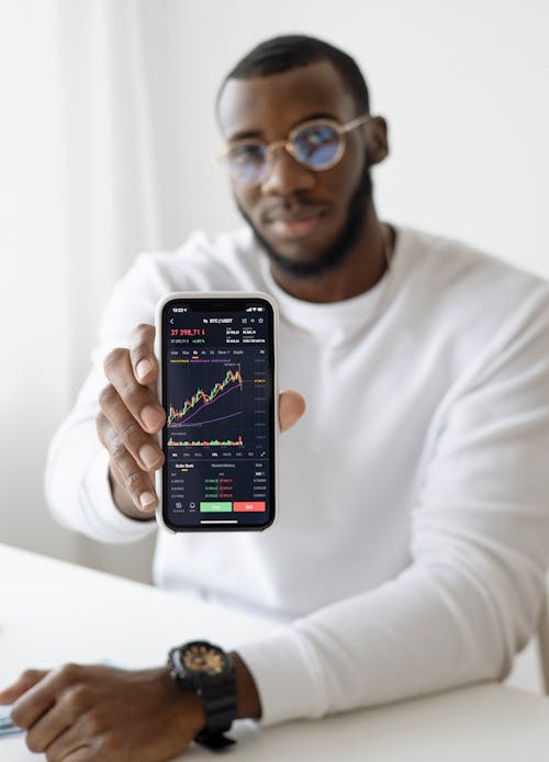 Man holding Black Smartphone 