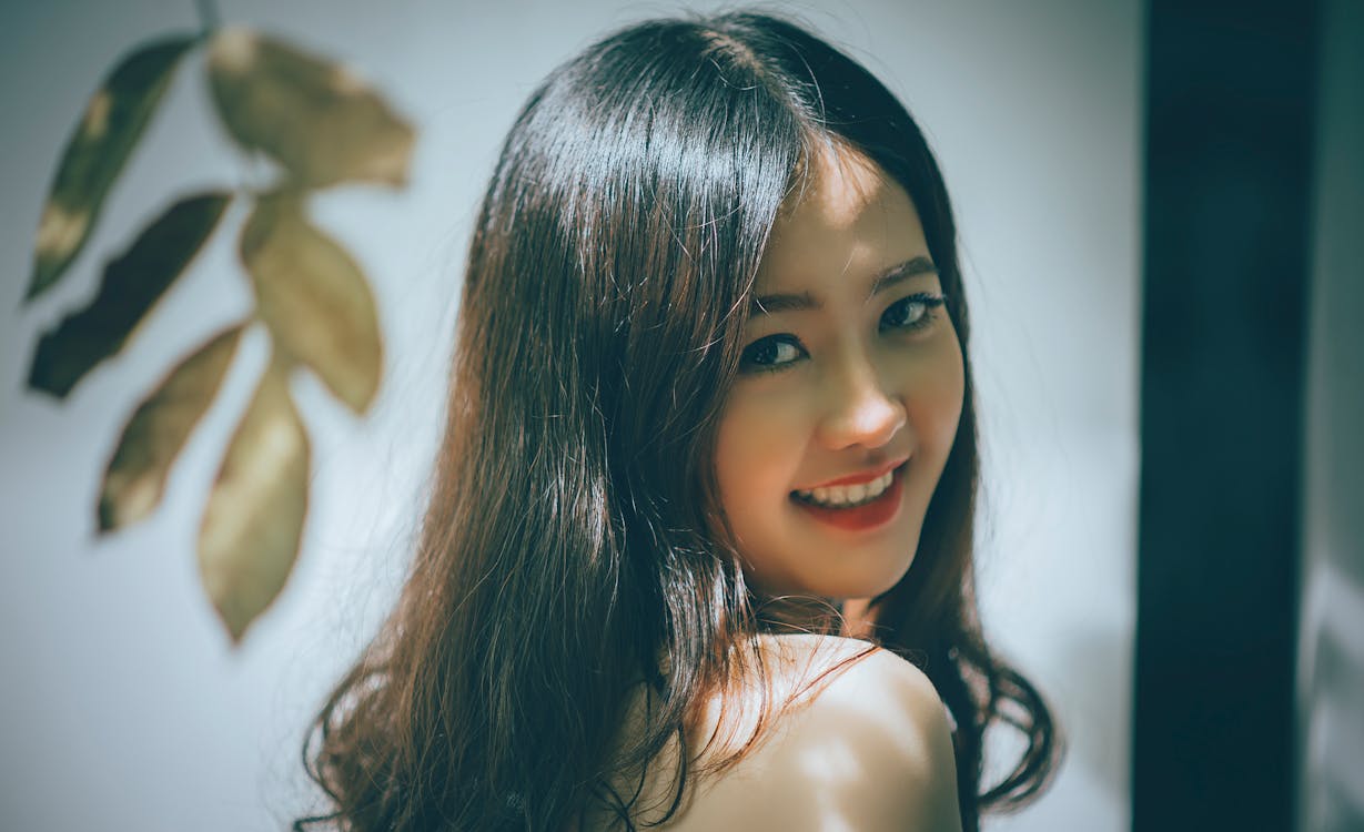 Woman with Black Long Hair Smiling  