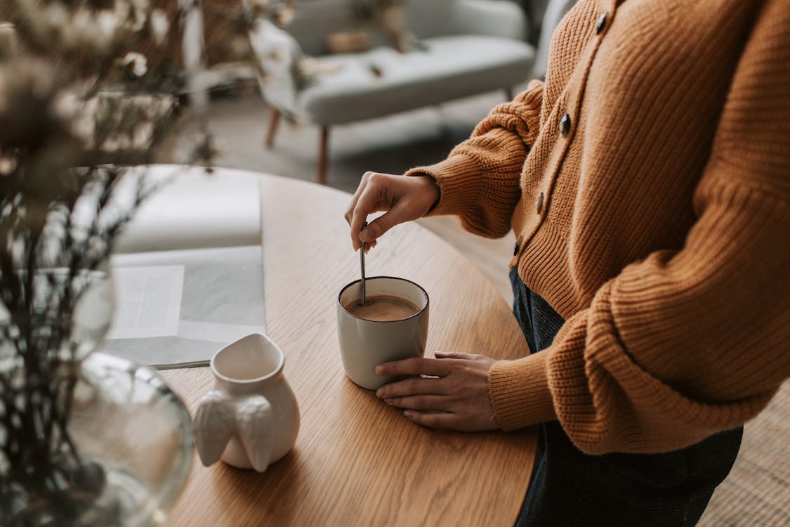 a lady making coffee