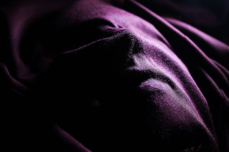 Purple Textile Covering A Person's Face