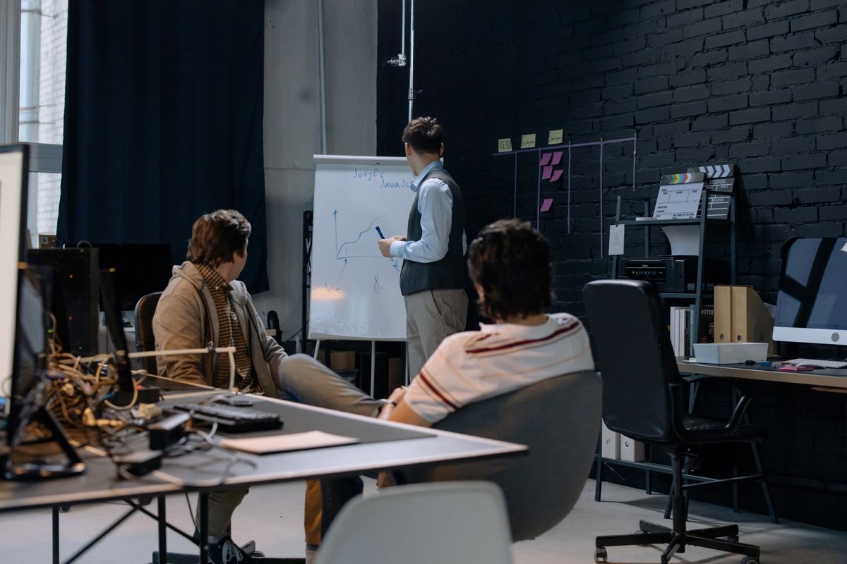 Marketing and sales aligning at a whiteboard