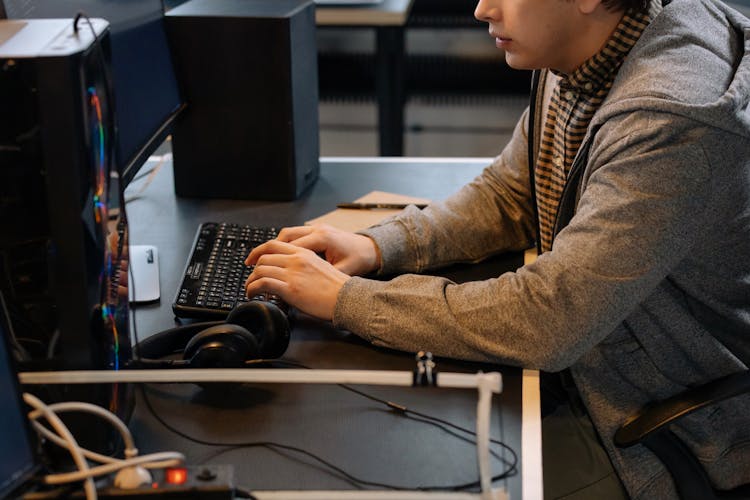 Man Sitting And Working On Computer