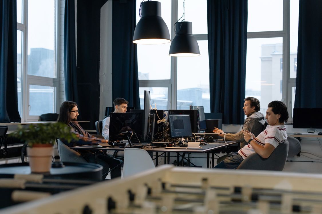 Employees Sitting at Desks in Office · Free Stock Photo