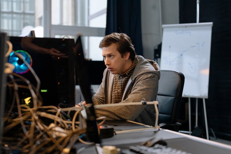 Man Working On Computer In An Office 