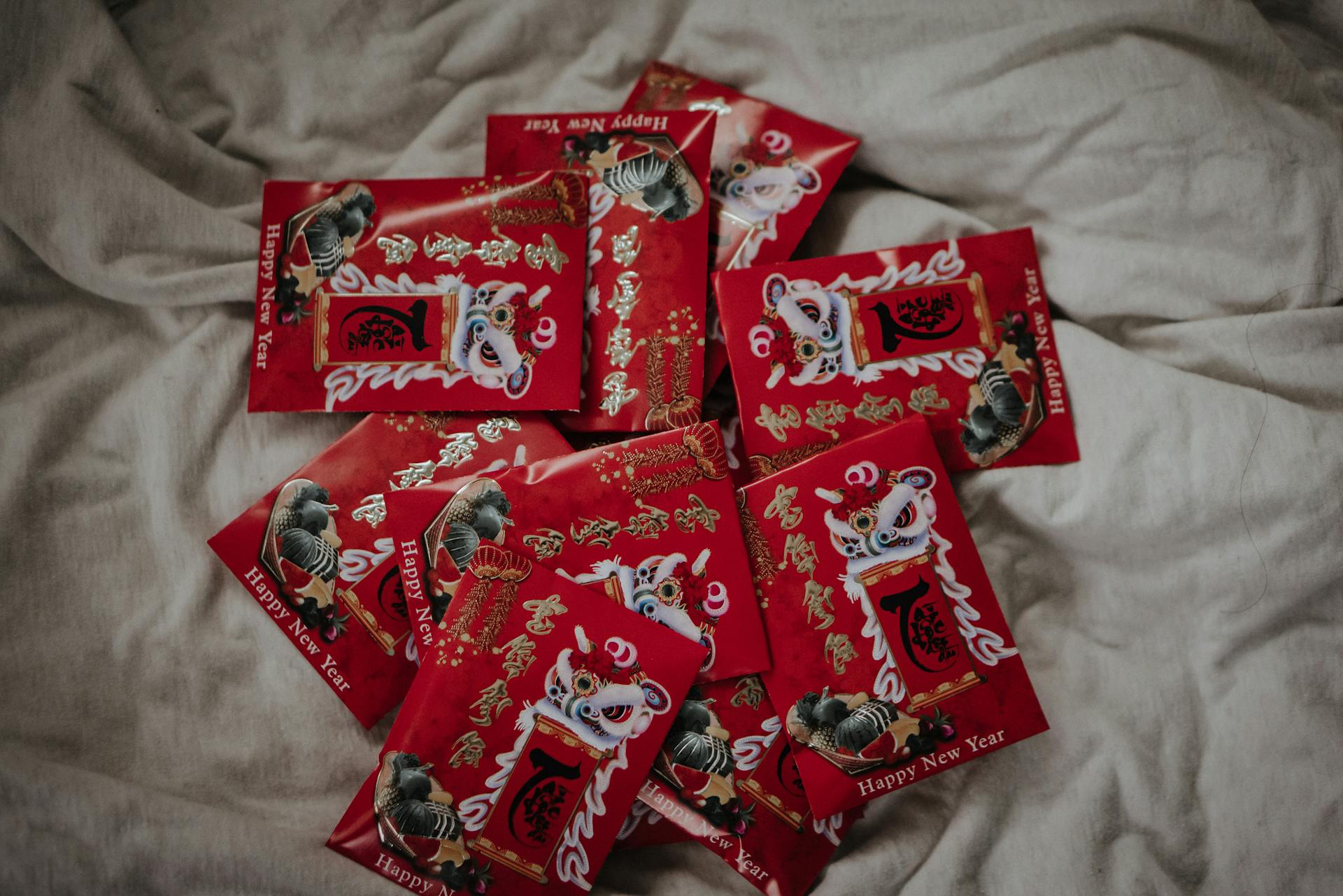 Red and White Chinese Envelopes on White Textile