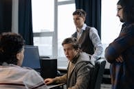 Group of Men Talking in an Office