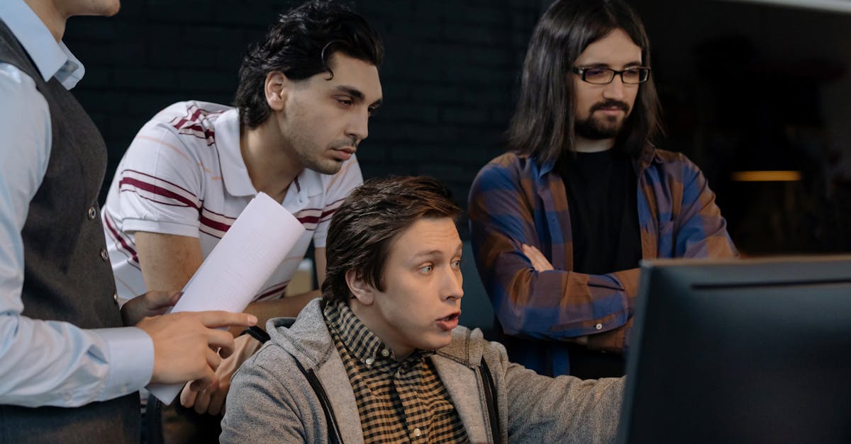 A diverse group of adults working together in a modern office environment, showcasing teamwork and collaboration.