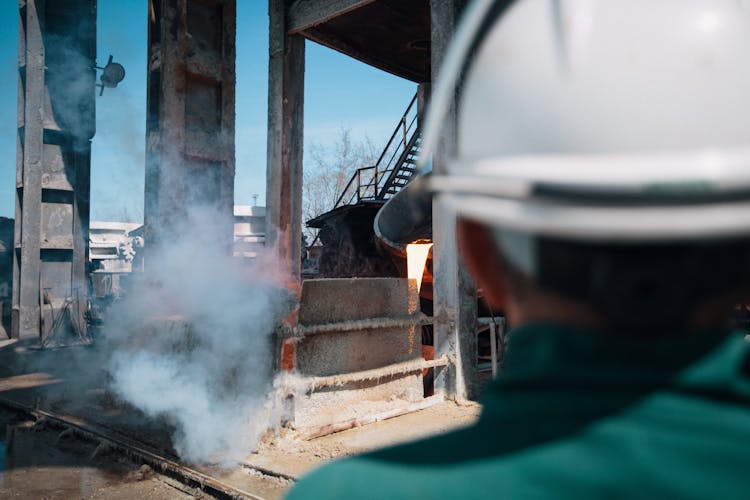 Industrial Worker Looking At Smoke