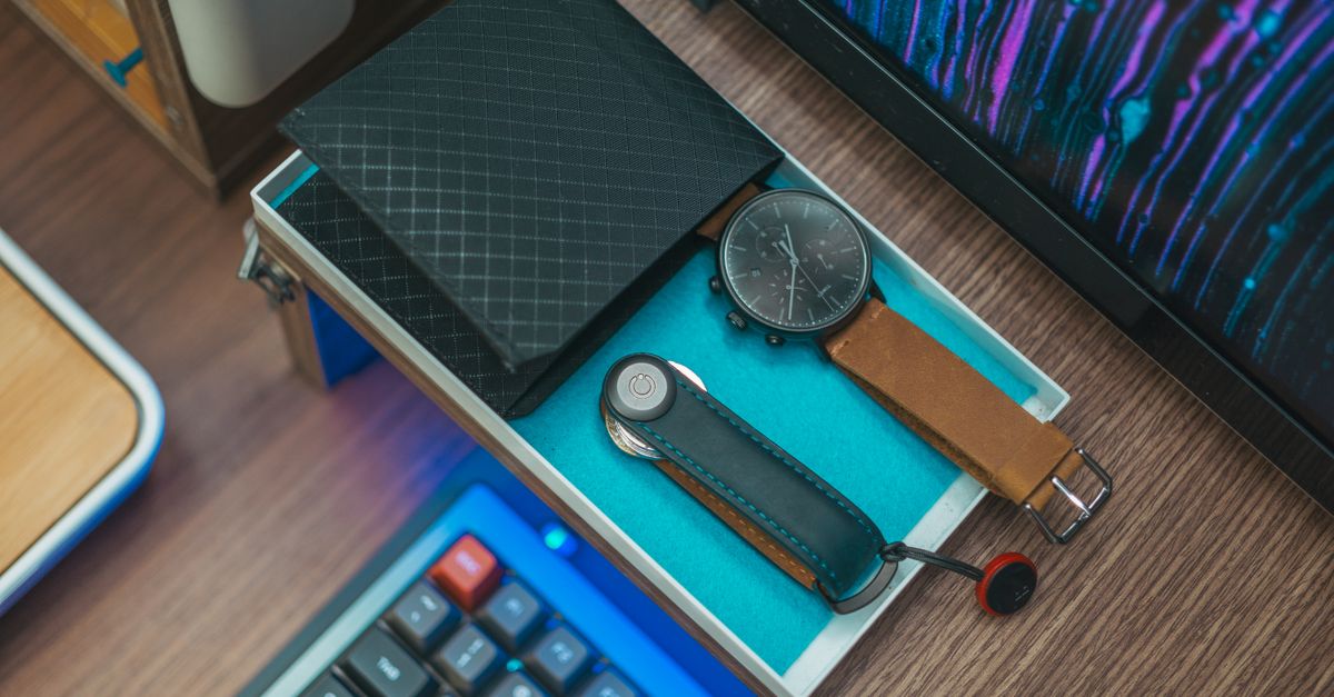 Representative mens accessories including wallet and watch