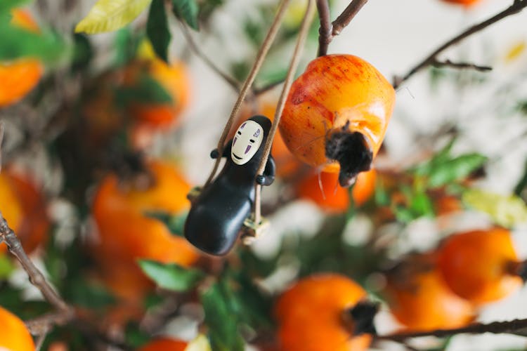 Close-up Of An Ornament Hanging On A Fake Kaki Tree