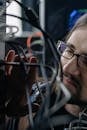 Man Connecting Computer Cables