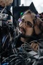 Man Fixing Cables of Computer