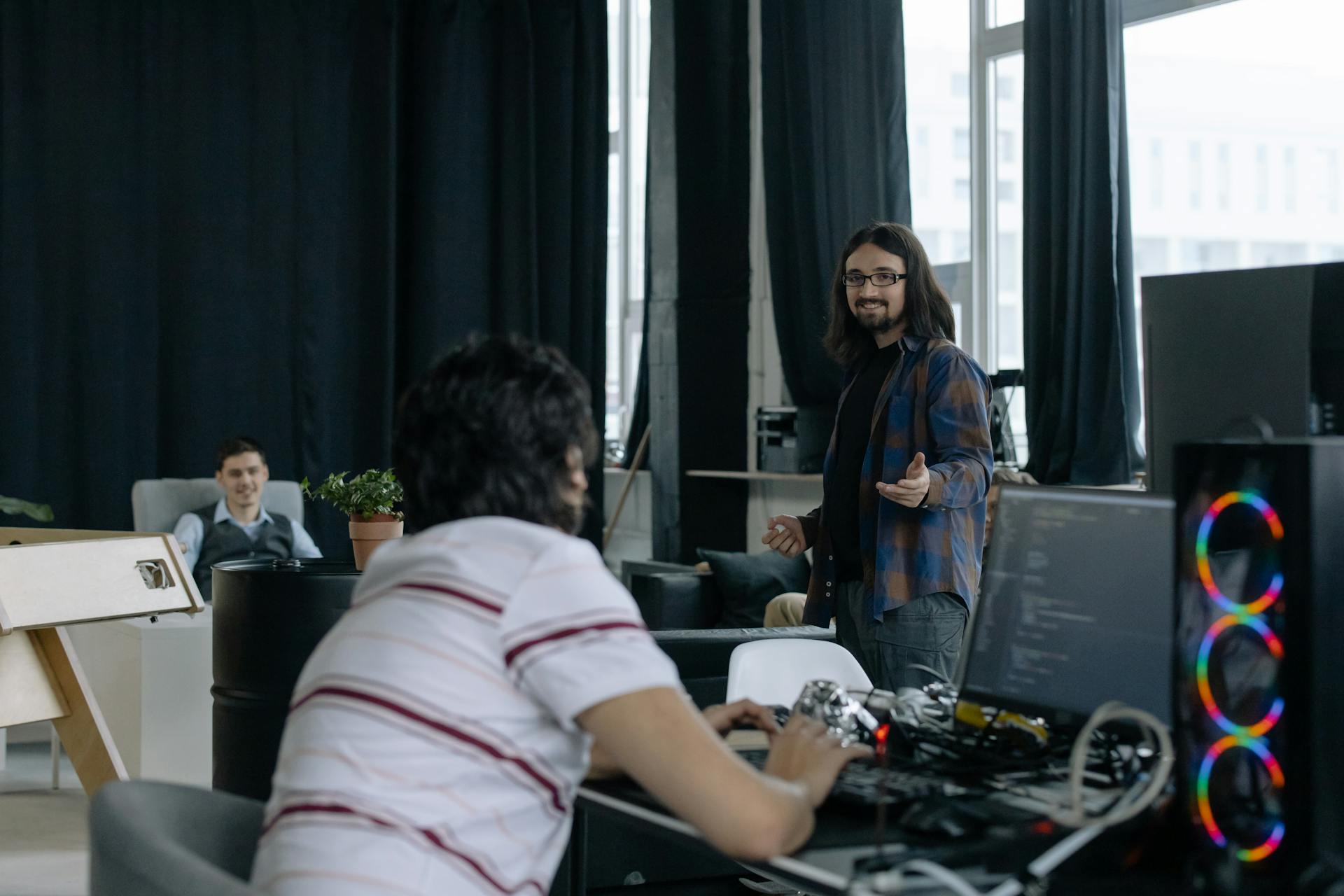 Young professionals collaborating in a modern software company office space.