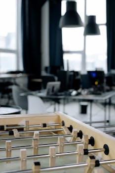 Creative workspace with foosball table in modern startup office setting