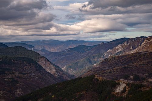 Free A breathtaking view showcasing expansive mountains and dramatic skies, ideal for nature enthusiasts. Stock Photo