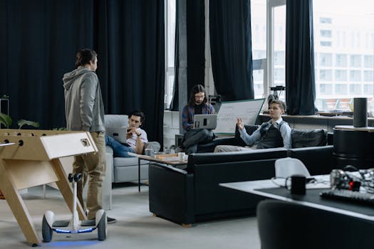 Group of young professionals collaborating in a creative and modern office space.