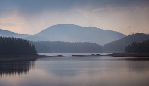 Dawn at Lake in Mountain Landscape