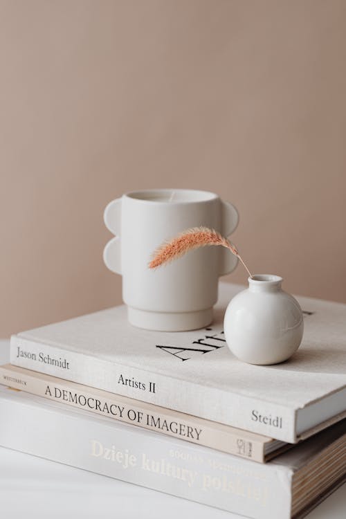 Minimalist Vases on Books on Nude Background