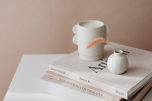 White Ceramic Mug on White Book