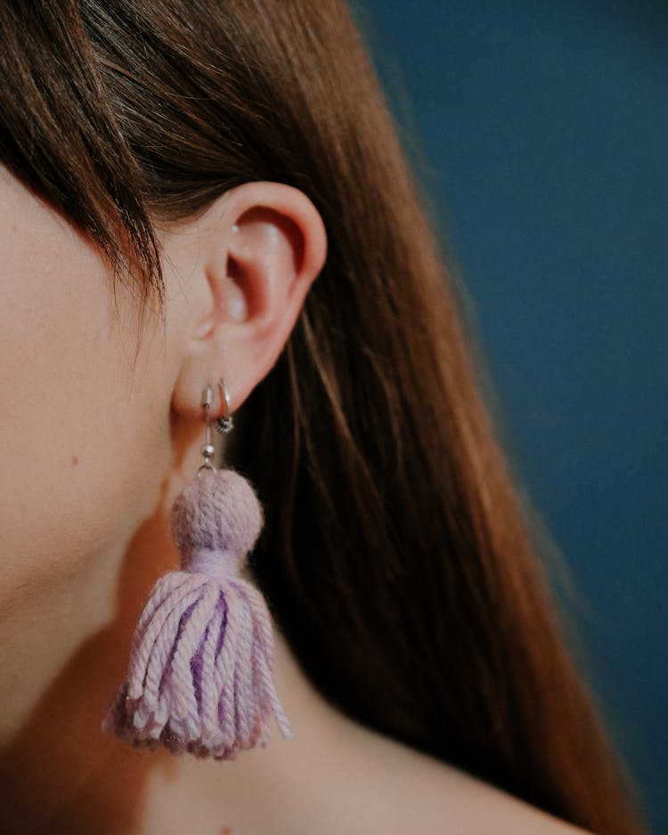 Unrecognizable Woman Wearing Earrings With Yarn Tassels