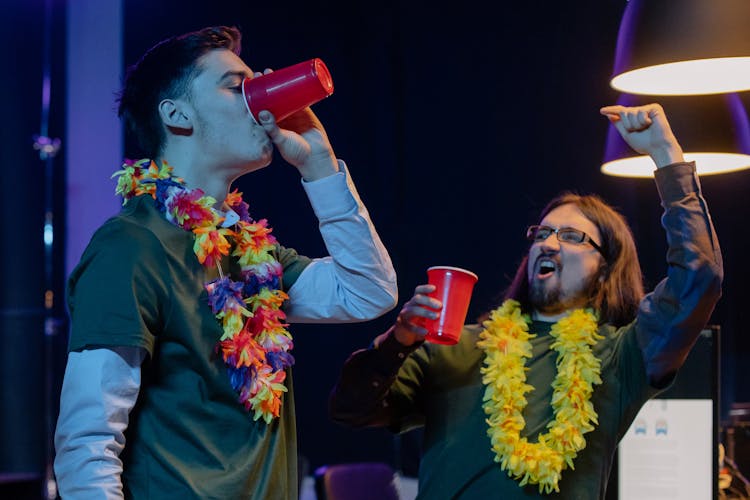 Colleagues Dancing And Drinking At A Company Party