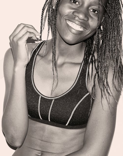 Woman in Sport Bra With Braided Hair Grayscale Photo