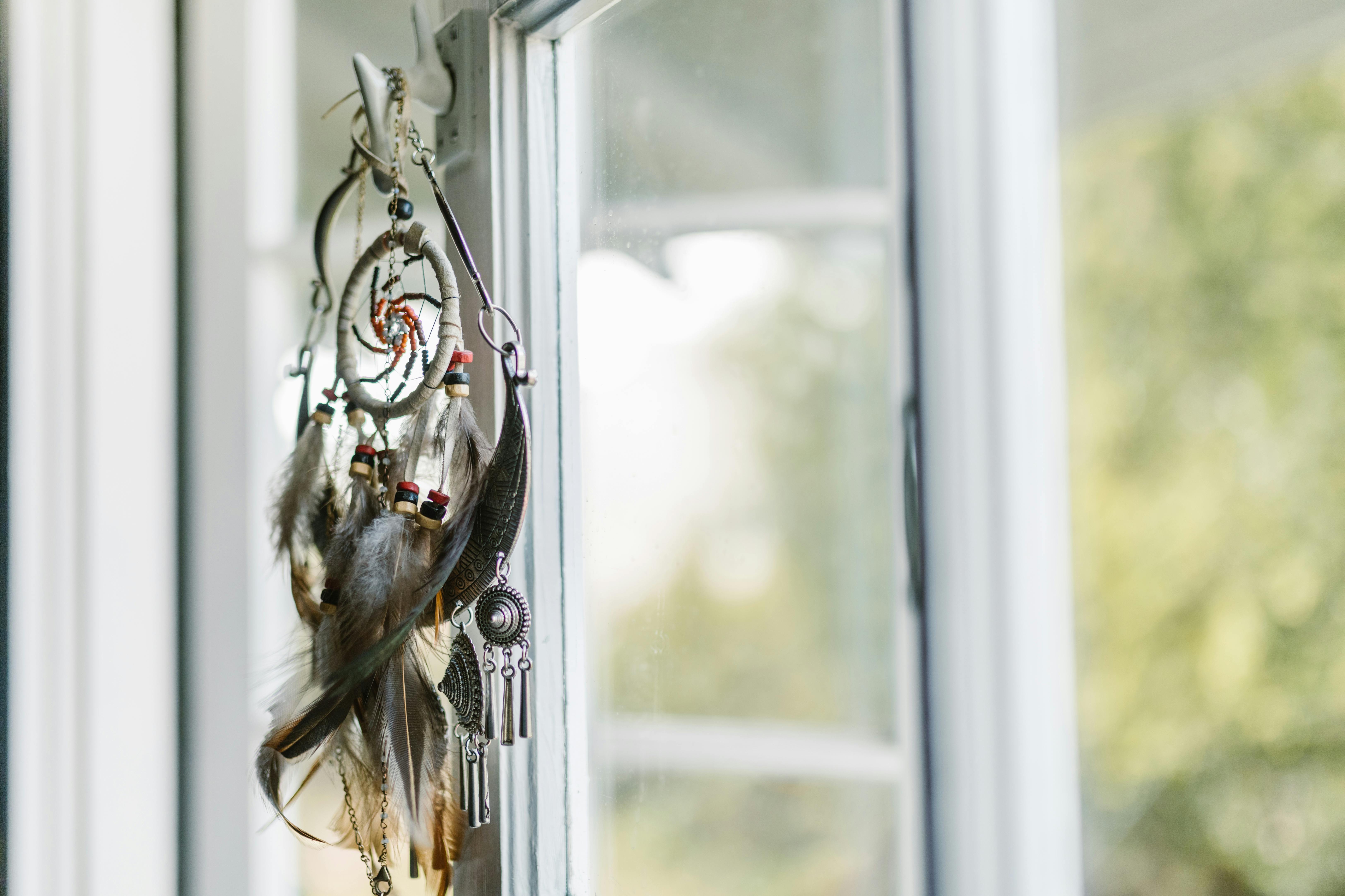 black and white dream catcher hanged on window