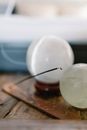 White Round Ornament on Brown Wooden Table
