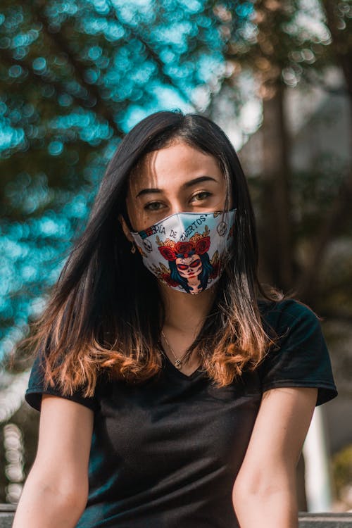 Free Woman in Black Crew Neck T-shirt With White and Red Mask Stock Photo
