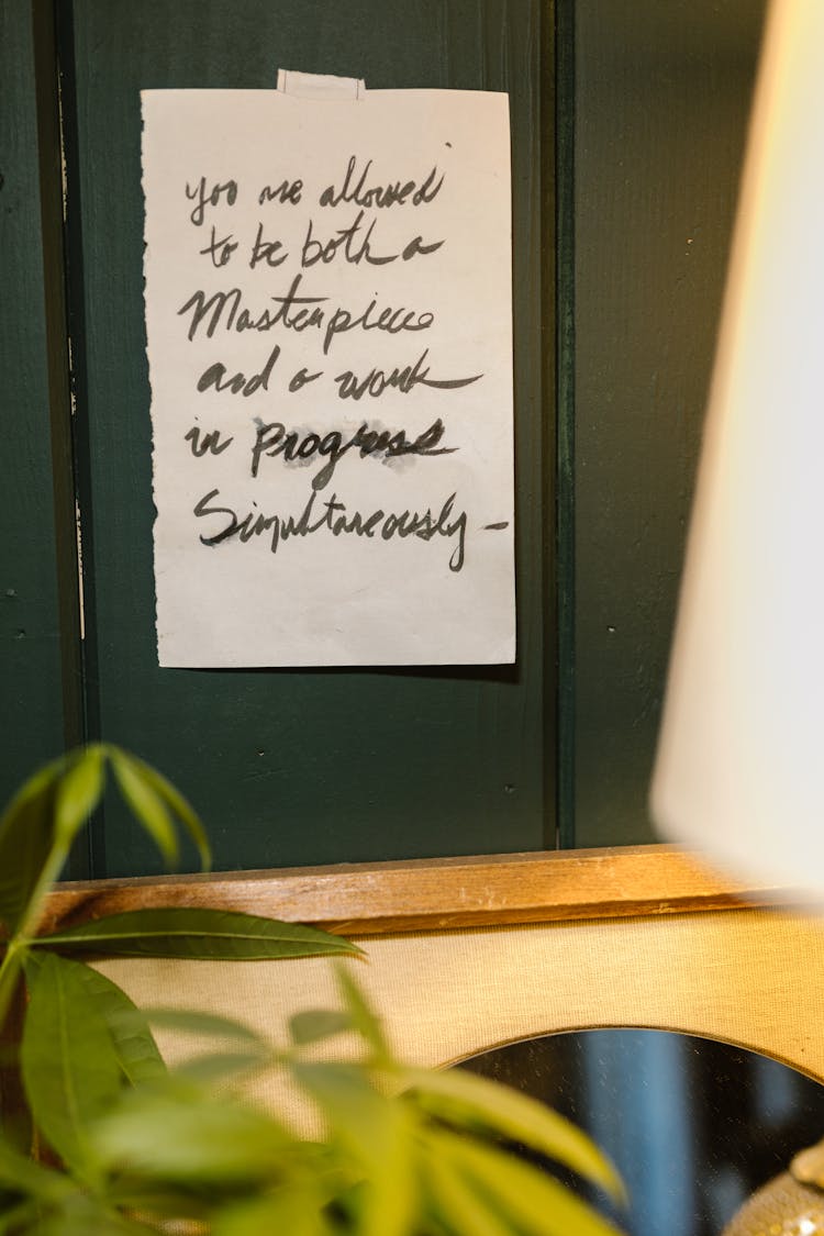 A Note Posted On The Black Wall