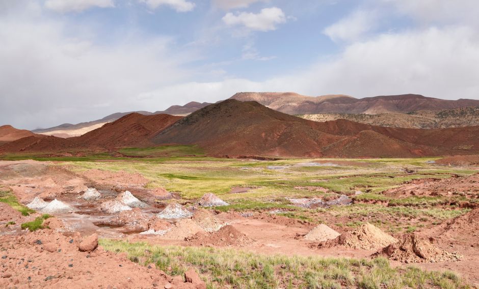 Explore the stunning red hills of Telouet, Morocco, showcasing unique geological formations.