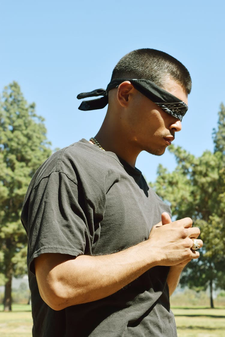 Masculine Man In Blindfold In Summer Park