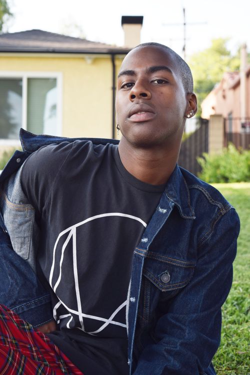 Trendy black man in denim jacket on meadow · Free Stock Photo