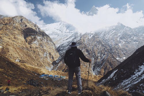 A Man Standing on a Mountain