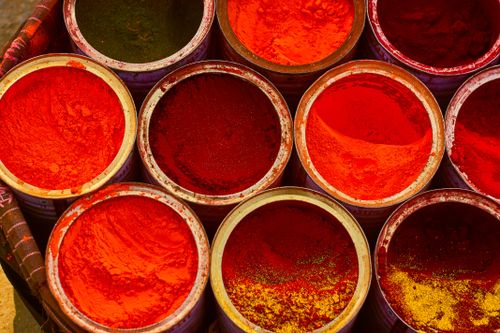 Free A colorful assortment of spices in buckets, showcasing vibrant red hues. Stock Photo