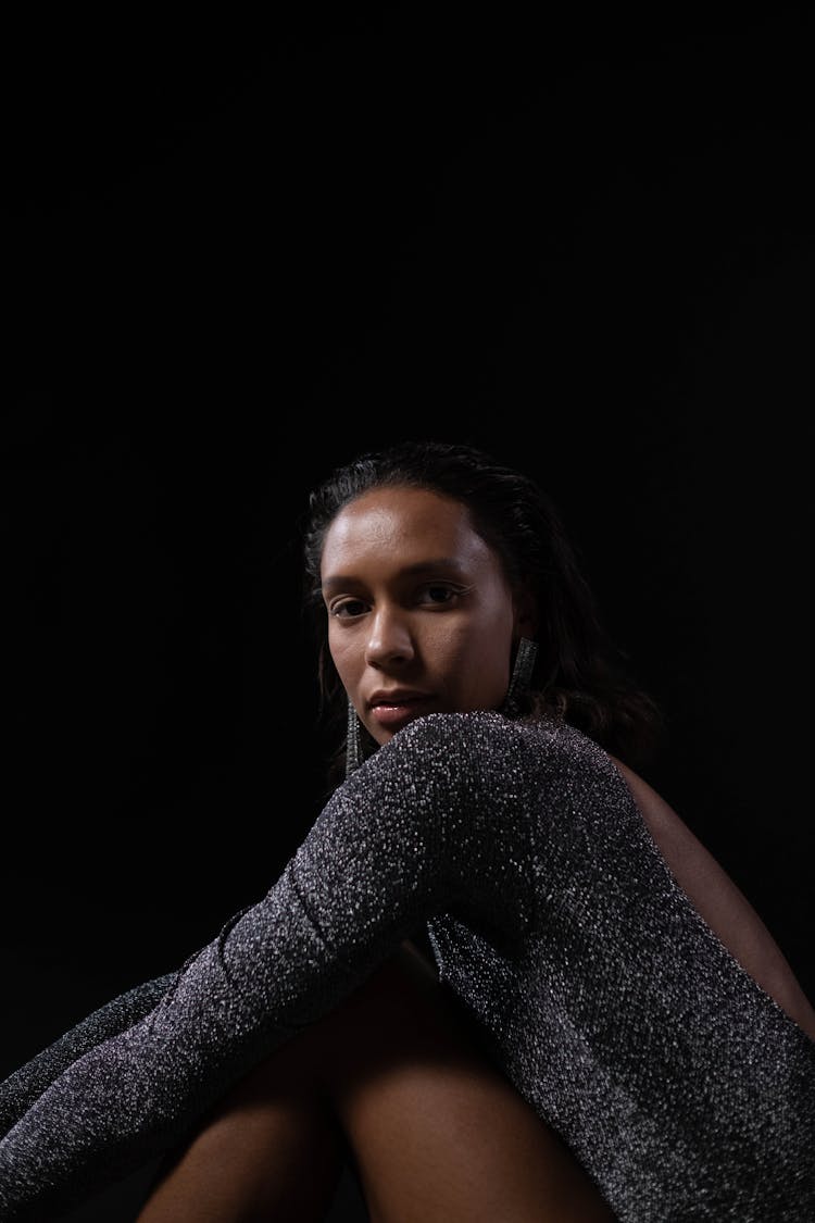 Woman Posing In Gray Sparkly Dress