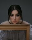 A Beautiful Woman with Her Head on a Desk