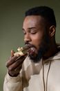 A Man Eating a Layered Cake